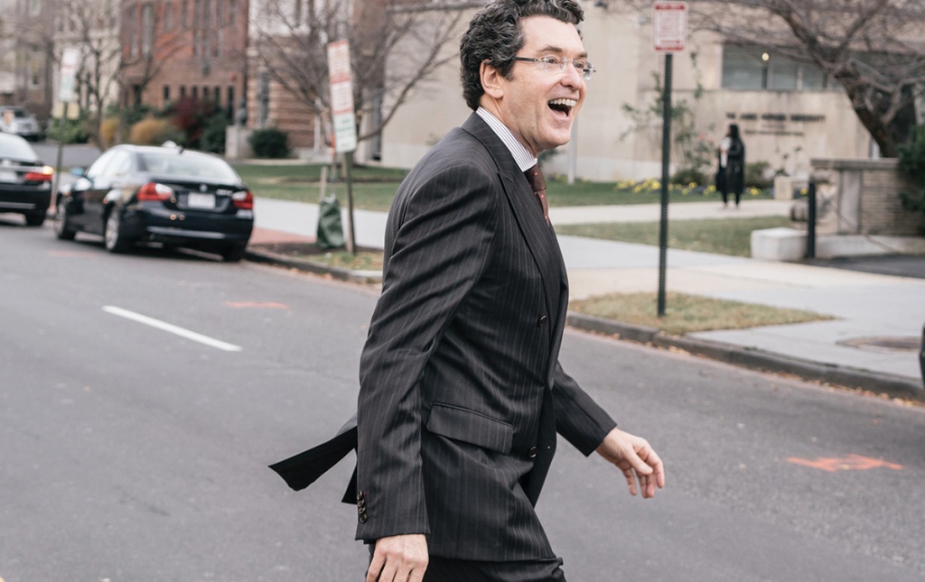 Photograph of Norman Eisen &rsquo;85 crossing a street in Washington D.C.